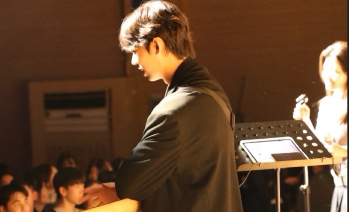 A student band performing on stage